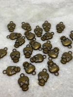 Skull/ doodskop bedel brons17x10 mm (54 stuks)